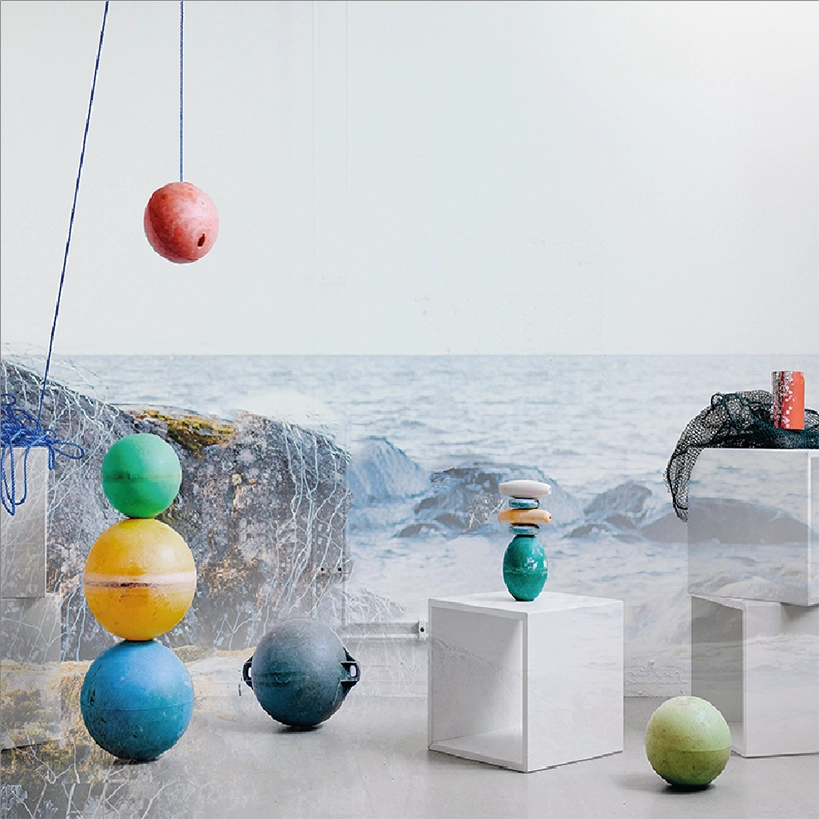 Recycled fishing floats arranged in a minimal composition highlighting form and material.