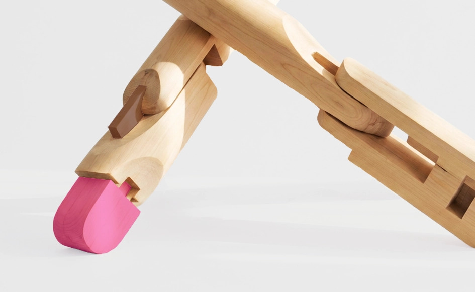 Sculptural wooden objects with integrated pink elements, highlighting material contrast and precise construction.