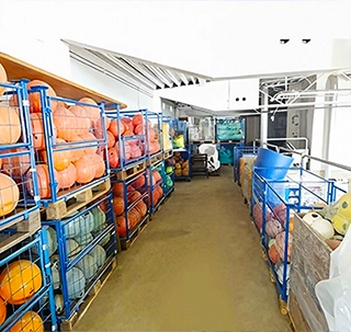 Sorted sea waste materials arranged indoors by type and color