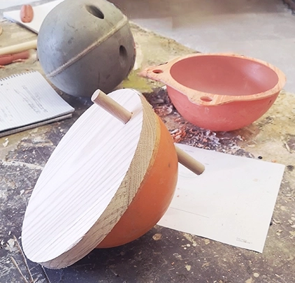 cut fishing buoys repurposed as storage bowls